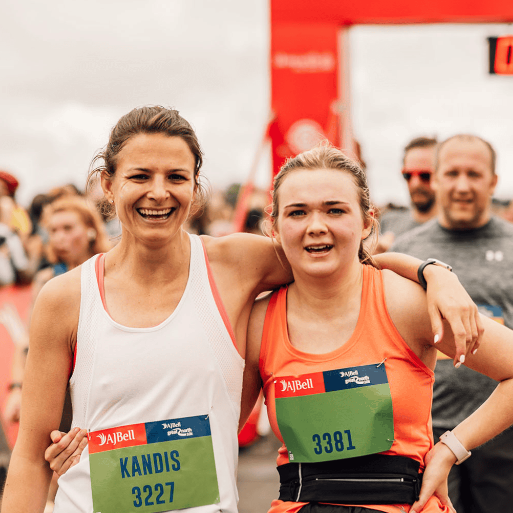 1 AJ Bell Great North 10k Two runners celebrating after finishing a race