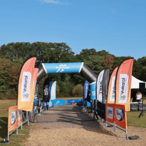 RunThrough race start line with sponsor banners