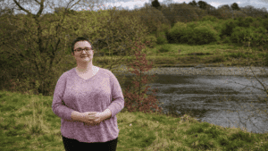 Nicola standing in front of a river