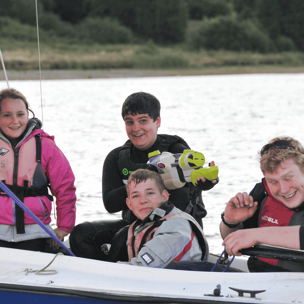 2 Children in boat getting ready to have a waterfight